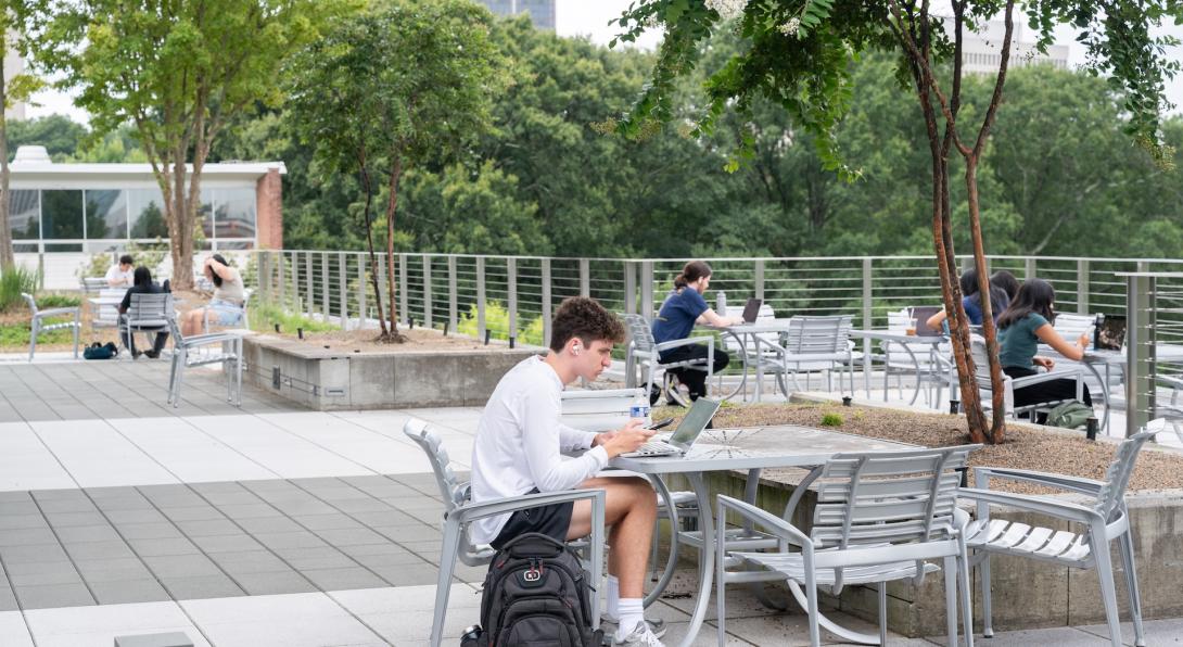 Students studying on the Clough rooftop.